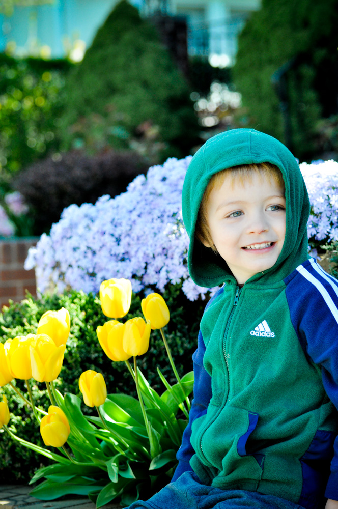 Child portrait near flowers