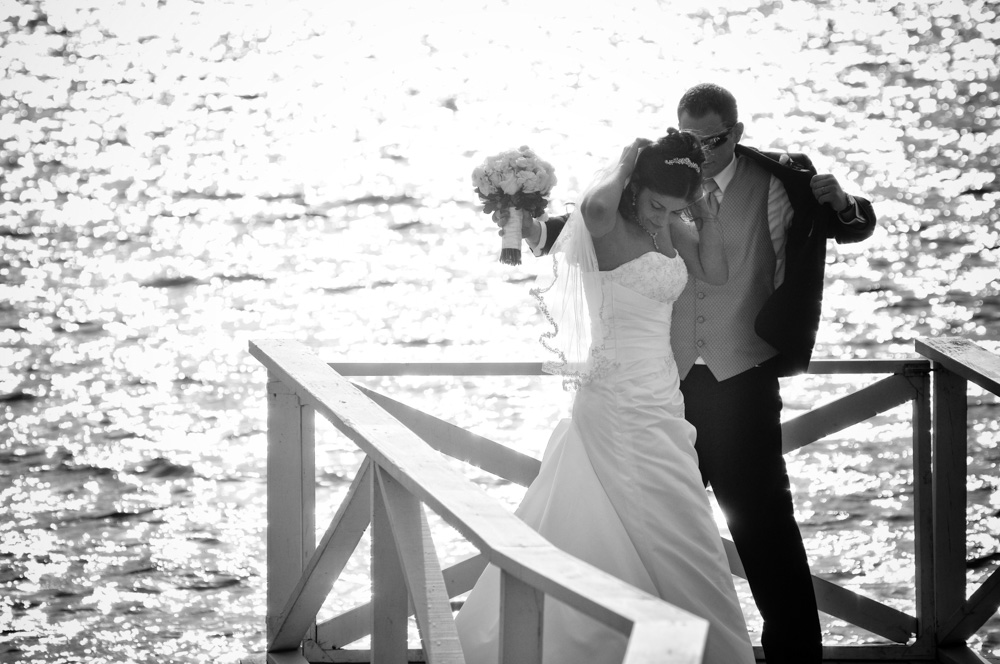 Wedding couple walking on a pier (black and white)