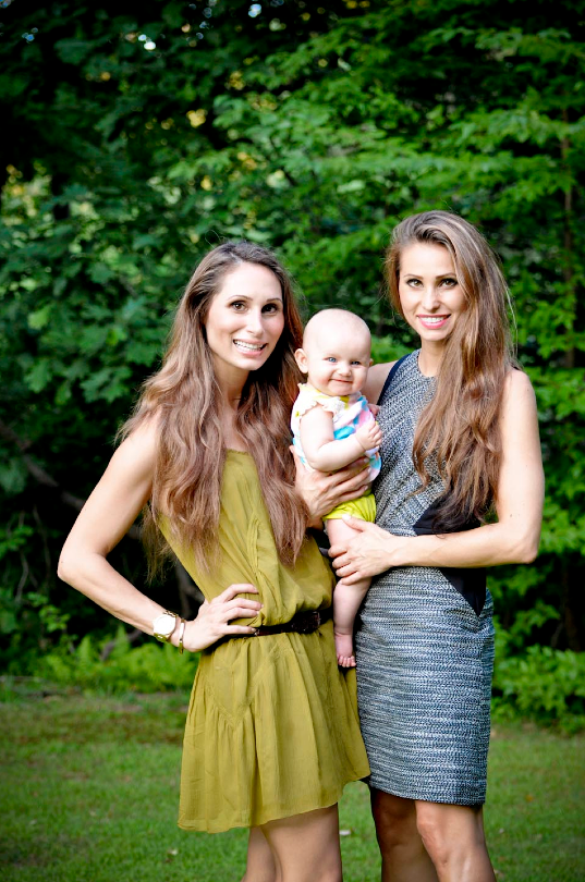 Two women with a baby outdoors